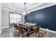 An elegant dining room showcasing stylish lighting, a sleek table, and a bold accent wall for a modern look at 4850 Wilshire Xing, Cumming, GA 30040