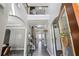 Inviting foyer featuring archways, staircase, and elegant decor, enhancing the home's entrance and flow at 4850 Wilshire Xing, Cumming, GA 30040