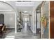 Inviting foyer featuring archways, staircase, and elegant decor, enhancing the home's entrance and flow at 4850 Wilshire Xing, Cumming, GA 30040