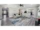 Inviting living room with modern sofas, a decorative rug, an arched doorway, and ample natural light at 4850 Wilshire Xing, Cumming, GA 30040