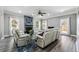 Bright living room featuring a fireplace, comfortable seating, and modern decor for relaxing in style at 4850 Wilshire Xing, Cumming, GA 30040
