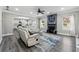 Inviting living room featuring a fireplace, stylish decor, and open layout for comfortable gathering at 4850 Wilshire Xing, Cumming, GA 30040