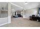 Large bedroom suite with a sitting area, tray ceilings, and neutral colors to make it feel light and airy at 4850 Wilshire Xing, Cumming, GA 30040