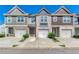 Charming townhomes featuring attached garages, private driveways, and stylish brick and siding exteriors at 5009 Longview Walk, Decatur, GA 30035