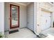 Welcoming front door adjacent to a one-car garage of the townhome at 5009 Longview Walk, Decatur, GA 30035