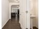Hallway view of the half bathroom, living room and kitchen at 5009 Longview Walk, Decatur, GA 30035