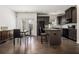 Modern kitchen with stainless steel appliances, dark cabinetry and an eat-in island at 5009 Longview Walk, Decatur, GA 30035