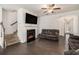 Comfortable living room with fireplace, hardwood floors, and staircase at 5009 Longview Walk, Decatur, GA 30035
