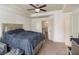 Spacious main bedroom with a ceiling fan, plush carpet, and access to the Primary bathroom and closet at 5009 Longview Walk, Decatur, GA 30035