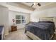 Bright bedroom with a ceiling fan, an outside view through the window, and an additional seating area at 5009 Longview Walk, Decatur, GA 30035