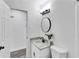 Clean bathroom with granite countertop, black hardware, and vanity lighting at 5774 Forest Dr, Acworth, GA 30102