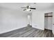 Bedroom with light gray hardwood floors and access to hallway and closet at 5774 Forest Dr, Acworth, GA 30102