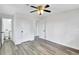 The bedroom has gray vinyl flooring, white walls, and easy access to the bathroom at 5774 Forest Dr, Acworth, GA 30102