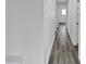 Hallway features light gray hardwood floors and leads to the bedroom and bathroom at 5774 Forest Dr, Acworth, GA 30102