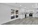 Modern kitchen offers a sliding glass door, stainless steel appliances, granite counters and sleek cabinetry at 5774 Forest Dr, Acworth, GA 30102