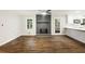 Spacious living room with dark wood floors, a fireplace, and ample natural light at 1019 Crestwood Ln, Stone Mountain, GA 30087