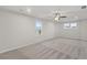 This bedroom offers natural light, neutral paint, and cozy carpet at 1651 Tide Mill Rd, Cumming, GA 30040