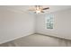 Comfortable bedroom featuring neutral carpeting, a ceiling fan and a window at 1651 Tide Mill Rd, Cumming, GA 30040