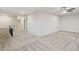 Spacious bonus room features modern carpet, neutral walls, and ceiling fan at 1651 Tide Mill Rd, Cumming, GA 30040