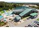 Aerial view of the community aquatic center featuring pools, water slides, picnic areas, and parking at 1651 Tide Mill Rd, Cumming, GA 30040