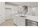 Bright kitchen featuring stainless steel appliances, a center island with sink, and ample cabinet storage at 1651 Tide Mill Rd, Cumming, GA 30040