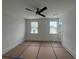 Well-lit bedroom showcasing two windows, ceiling fan, and fresh paint, ready for personalization at 1714 Gunnin Nw Trce # 237, Atlanta, GA 30318