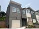 Charming new construction townhomes with varying color schemes and well-maintained landscaping at 1714 Gunnin Nw Trce # 237, Atlanta, GA 30318