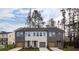 Modern townhome duplex featuring a two-car garage, neutral paint, and manicured lawn and landscaping at 1714 Gunnin Nw Trce # 237, Atlanta, GA 30318