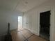 Bright hallway featuring a double door closet, access to other rooms, and neutral decor at 1714 Gunnin Nw Trce # 237, Atlanta, GA 30318
