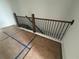 Modern staircase with wood handrail and black iron balusters enhances the contemporary design at 1714 Gunnin Nw Trce # 237, Atlanta, GA 30318