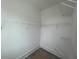 Empty walk-in closet with wire shelves and neutral paint waiting for your personal organization at 1714 Gunnin Nw Trce # 237, Atlanta, GA 30318
