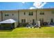 Large backyard with a patio, green grass, and ample space for outdoor activities and relaxation at 221 Irwell Path, Lawrenceville, GA 30044