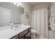 Clean bathroom with shower-tub combo, vanity, and neutral color scheme at 221 Irwell Path, Lawrenceville, GA 30044