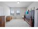 Comfortable bedroom featuring hardwood floors and plenty of natural light at 221 Irwell Path, Lawrenceville, GA 30044