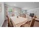 Comfortable dining room connected to the living area with seating for six and natural light at 221 Irwell Path, Lawrenceville, GA 30044