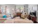 Inviting living area with patterned armchairs, hardwood floors, and a flat-screen TV at 221 Irwell Path, Lawrenceville, GA 30044