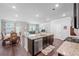 Open-concept kitchen and living area with hardwood floors and plenty of natural light at 221 Irwell Path, Lawrenceville, GA 30044