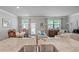 Bright living space with a view of the kitchen, dining area and large windows at 221 Irwell Path, Lawrenceville, GA 30044