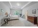 Spacious main bedroom features a tray ceiling, large windows, and ensuite bathroom access at 221 Irwell Path, Lawrenceville, GA 30044