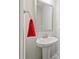 Modern powder room featuring a pedestal sink and stylish fixtures at 221 Irwell Path, Lawrenceville, GA 30044