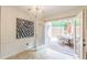 Bright dining room with chandelier, art and french doors to brick patio at 4101 Dunwoody Club Dr # 49, Atlanta, GA 30350
