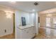 Kitchenette between dining room and hallway with white cabinets and granite countertop at 4101 Dunwoody Club Dr # 49, Atlanta, GA 30350