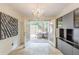 Bright dining area with chandelier, modern cabinet, and patio view at 4101 Dunwoody Club Dr # 49, Atlanta, GA 30350