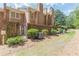 View of the brick exterior of the townhome with a brick patio and landscaping at 4101 Dunwoody Club Dr # 49, Atlanta, GA 30350