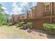 View of the brick exterior with a brick patio and landscaping at 4101 Dunwoody Club Dr # 49, Atlanta, GA 30350