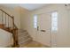 Inviting foyer with tiled floor, carpeted stairs, and a white front door at 4101 Dunwoody Club Dr # 49, Atlanta, GA 30350