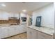 Spacious kitchen featuring granite countertop, white cabinets, and built-in oven at 4101 Dunwoody Club Dr # 49, Atlanta, GA 30350