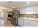 Modern kitchen featuring stainless appliances, marble countertops, and stone tile backsplash at 4101 Dunwoody Club Dr # 49, Atlanta, GA 30350