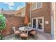 This brick patio offers an umbrella covered table and seating for six people at 4101 Dunwoody Club Dr # 49, Atlanta, GA 30350