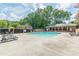 Community pool with lounge chairs and umbrella-covered tables at 4101 Dunwoody Club Dr # 49, Atlanta, GA 30350